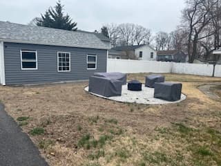 Backyard with fire pit seating at 1735 Fairhill Drive
